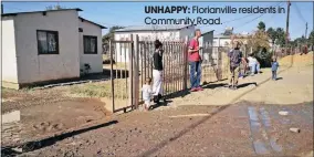  ??  ?? UNHAPPY: Florianvil­le residents in Community Road.