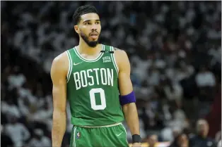  ?? ?? Jayson Tatum is in the NBA Finals for the first time with the Boston Celtics after they beat the Miami Heat in seven games. Stephen Curry and the Warriors had an easier time with the Dallas Mavericks to reach the finals for the sixth time in eight seasons.