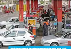  ??  ?? TEHRAN: Iranian drivers fill their tanks at a gas station in the capital Tehran. —AFP