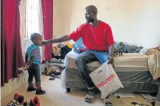  ??  ?? DISTANT DADDY: Zipporah Lottering, aged one, visits her father who lives in Philippi, 6km from Manenberg. Kazuba sees his daughter once every two months