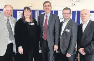  ??  ?? ● David Rutley (centre) with the Neighbourh­ood Plan team including● ouncillor Phil Hoyland (far left) and Malcolm Adams (far right) C