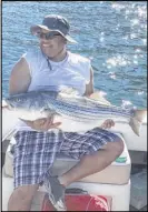  ?? Larry Hanson ?? Larry Hanson of Henderson with a 33-pound striped bass caught at Willow Beach.