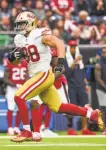  ?? Daniel Dunn / Getty Images ?? Tight end Garrett Celek had a career-long 61-yard reception during the 49ers’ win in Houston on Sunday.