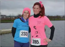  ??  ?? Linda O’ Sullivan and Csille Vemossy were all smiles despite the cold on Sunday morning ahead of the Tralee Valentines 10-mile run.