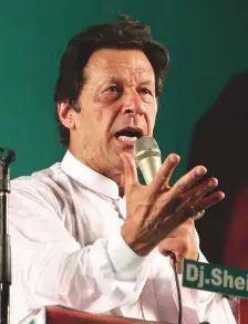  ?? AP ?? Imran Khan addresses supporters during an election campaign in Lahore on July 23.