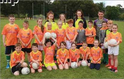  ??  ?? Star Cork footballer, Seán Powter, with the U-8s and their junior coaches at the Macroom GAA Cúl Camp.