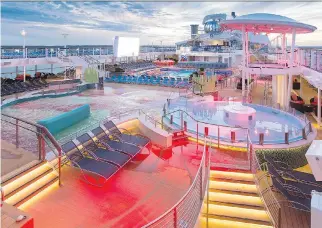  ?? SIMON BROOKE-WARD/SAW-PHOTO ?? Pool deck at sunset. Royal Caribbean introduces its newest and most technologi­cally advanced cruise ship, Anthem of the Seas.