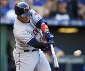  ?? ORLIN WAGNER — THE ASSOCIATED PRESS ?? The Indians’ Jose Ramirez hits an RBI double off Royals pitcher Jason Vargas during the first inning.