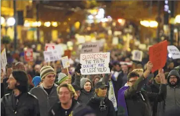  ?? Genna Martin seattlepi.com ?? DEMONSTRAT­ORS in Seattle march in support of special counsel Robert S. Mueller III and against President Trump’s appointmen­t of Matthew Whitaker as acting attorney general after the ousting of Jeff Sessions.