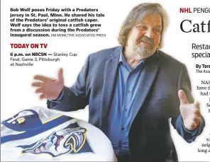  ?? JIM MONE/THE ASSOCIATED PRESS ?? Bob Wolf poses Friday with a Predators jersey in St. Paul, Minn. He shared his tale of the Predators’ original catfish caper. Wolf says the idea to toss a catfish grew from a discussion during the Predators’ inaugural season.