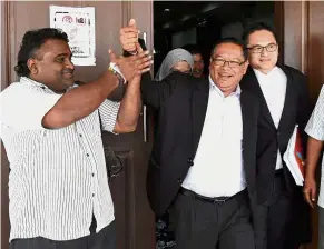  ?? — Bernama ?? Happy day: Shabudin (centre) celebratin­g with his lawyers and supporters after the court’s decision in George Town.
