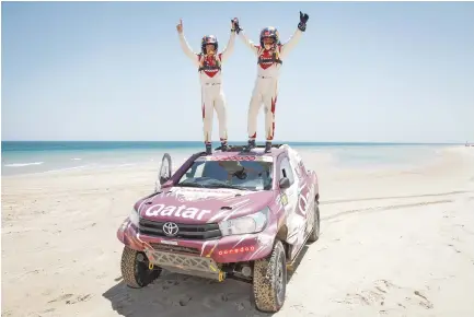  ??  ?? Nasser Saleh Al-Attiyah, right, and Matthieu Baumel after winning the Qatar Cross-Country Rally. (AN photos)