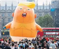  ?? LUKE MACGREGOR BLOOMBERG FILE PHOTO ?? The “Trump Baby” blimp, an effigy of former U.S. president Donald Trump, flew outside the Houses of Parliament on July 13, 2018, where demonstrat­ors gathered to protest Trump’s visit.