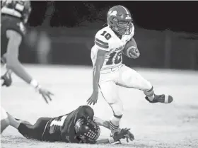  ?? SARAH PHIPPS/THE OKLAHOMAN ?? Chandler’s Casmen Hill tries to get by Kolton McCaslin during the high school football game between Luther and Chandler at Luther High School in Luther on Nov. 3.