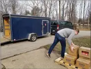  ?? SUBMITTED ?? A volunteer loads a truck bound for a local food pantry during UWLC’s recent emergency food distributi­on. With the aid of the nonprofit’s Relief Fund, and the generosity of the community, several of UWLC’s partner agencies and support programs are continuing to steadily provide for residents during the COVID-19pandemic.