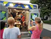  ?? DAN SOKIL - DIGITAL FIRST MEDIA ?? Children climb inside a Volunteer Medical Service Corps ambulance during National Night Out celebratio­ns in Upper Gwynedd on Tuesday.