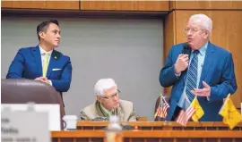  ?? EDDIE MOORE/JOURNAL ?? Sen. John Arthur Smith, D-Deming, answers a question about the budget bill Tuesday on the Senate floor. Next to him are Sen. Howie Morales, D-Silver City, left, and David Abbey, director of the Legislativ­e Finance Committee.