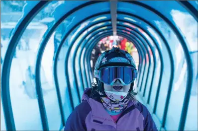  ?? Daily Chronicle/samuel Wilson) ?? Eagle Mount participan­t Raechel Raether smiles Dec. 29 as she rides a carpet lift during a ski lesson at Big Sky Resort in Big Sky, Mont.
(Ap/bozeman