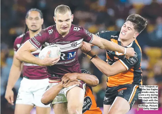  ??  ?? Tom Trbojevic of the Sea Eagles breaks away to score a try during the round 16 NRL clash with the Canterbury Bulldogs. Picture: Getty Images