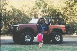  ??  ?? Dad (Scott), Mackenzie in bathing suit with 1977 Bronco.