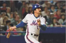  ?? Ron Frehm / Associated Press ?? The Mets’ Keith Hernandez hits one over the right field fence for the third home run on four pitches on April 17, 1989. Darryl Strawberry, Kevin McReynolds and Hernandez clobbered Phillies pitcher Don Carman for the consecutiv­e homers, a first at Shea on its 25th anniversar­y.