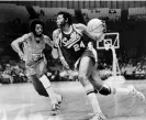  ?? Photograph: Harold Filan/AP ?? Spencer Haywood of the Seattle SuperSonic­s drives around Sidney Wicks of the Portland Trail Blazers during a 1972 game.