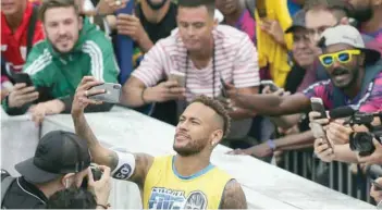  ?? — Reuters ?? Neymar takes a selfie with fans in the Neymar Jr’s Five soccer tournament in Santos, state of Sao Paulo, Brazil.