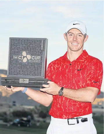  ?? AFP ?? Rory McIlroy poses with the trophy after winning the CJ Cup in Las Vegas on Sunday.