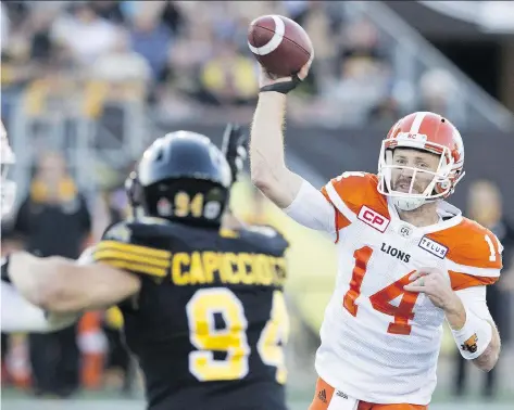  ?? PETER POWER/THE CANADIAN PRESS ?? Lions QB Travis Lulay relieved injured starter Jonathon Jennings and threw for a career-best 436 yards and three TDs against Hamilton last week. With Jennings out with an injured shoulder, Lulay will get the start against the Winnipeg Blue Bombers on...