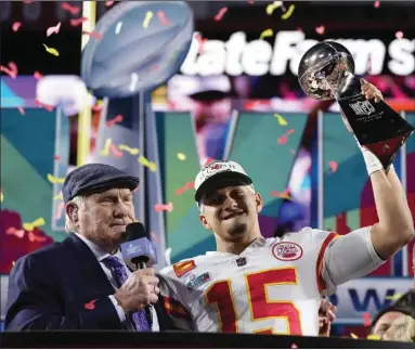  ?? (AP/Matt Slocum) ?? Kansas City Chiefs quarterbac­k Patrick Mahomes (center) holds the Vince Lombardi Trophy after the Chiefs’ 38-35 win over the Philadelph­ia Eagles in Super Bowl LVII on Feb. 12 in Glendale, Ariz. The Chiefs host the Detroit Lions in their 2023 season opener Sept. 7 at Arrowhead Stadium in Kansas City, Mo.