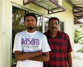  ??  ?? Big improvemen­t: Kalaivanan (left) with his father Manimaran. Kalaivanan can now walk and utter some words.