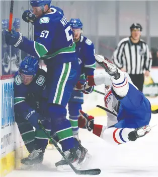  ?? JONATHAN HAYWARD/THE CANADIAN PRESS ?? Canadiens' Joel Armia goes down hard after a hit from Canucks defenceman Tyler Myers on Thursday. The NHL Department of Player Safety declined to suspend Myers for the hit.