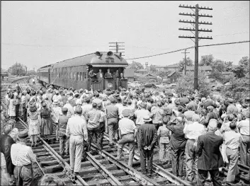  ?? Harold Valentine The Associated Press ?? Harry S. Truman greets a crowd in Crestline, Ohio, during his whistle-stop tour of U.S. towns ahead of the 1948 presidenti­al election. Truman would go on to win the election.