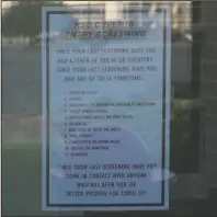  ?? The Sentinel-Record/James Leigh ?? SCREENING ATHLETES: A sign with screening questions is posted at an entrance to C.E. Formby Athletic Center at Henderson State University. Seven student-athletes tested positive after arriving on campus for voluntary summer workouts Sunday.