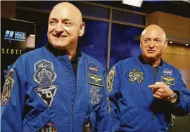  ?? Associated Press file photo ?? Research published Thursday about astronaut Scott Kelly, left, shows nothing that would cancel longer space treks. Scott’s body reacted strangely to nearly a year in orbit, compared to his twin brother Mark, right.