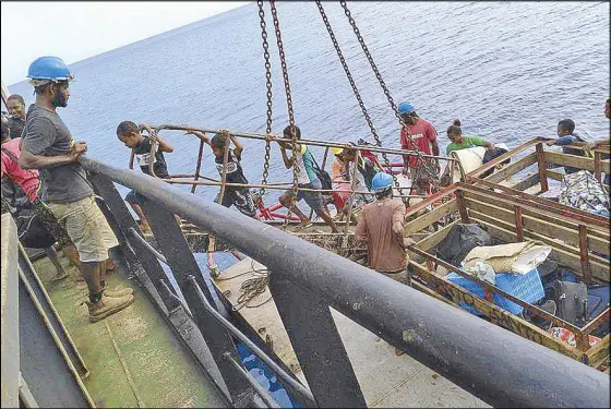  ??  ?? Children walk onto a boat as they are evacuated from the Pacific island of Ambae, which is part of Vanuatu, on Wednesday.