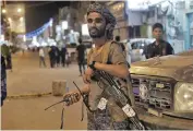  ?? AP ?? Fighters loyal to Yemen’s internatio­nally recognized government stand guard at the entrance of Yemen’s northeaste­rn city of Marib.