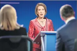  ?? Chip Somodevill­a
Getty Images ?? CARLY FIORINA’S performanc­e in the debate for lower-tier GOP candidates was well-received. She seeks to build on that by seizing on gender controvers­ies.