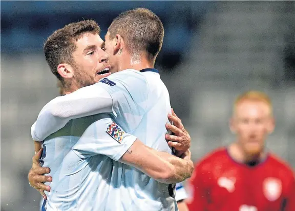  ?? Picture: PA. ?? Scotland scorers Ryan Christie and Lyndon Dykes celebrate after the latter scored his first goal for his country to equalise.