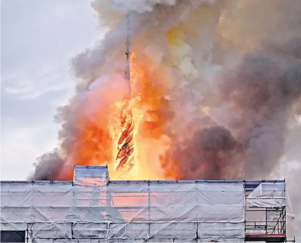  ?? ?? The famous spire of Borsen, one of Copenhagen’s oldest buildings, is consumed by flames, and left, Kroyer’s ‘From Copenhagen Stock Exchange’ (1895), is rescued from the blaze