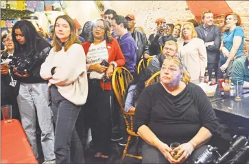  ?? File Cassandra Day / Hearst Connecticu­t Media ?? Supporters watch as the voting tallies are calculated Tuesday night at La Boca restaurant on Main Street in Middletown, where Democrats gathered after 8 p.m.