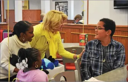  ?? MARIAN DENNIS — DIGITAL FIRST MEDIA ?? Talon Cleveland, 10, is told by Sunshine Foundation President Kate Sample, previous dreamer Cayla Fleming and her mother that Talon will be taking a trip to DisneyWorl­d in December.