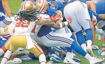  ?? N.Y. Post: Charles Wenzelberg ?? CAN’T MAKE IT: Daniel Jones tries to fight for a yard on a failed fourth-down conversion attempt during the second half of the Giants’ 36-9 loss to the 49ers on Sunday.