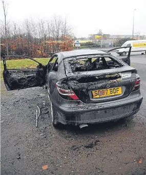  ??  ?? The fire-ravaged Mercedes in the car park at Caird Park, Dundee.