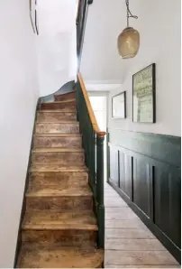  ??  ?? An understate­d glass pendant from Rockett St George hangs in this simple space, in which the original flooring and stairs have been retained