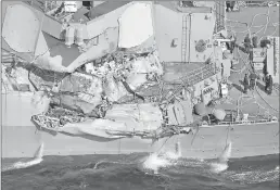  ?? Associated Press ?? The damage of the right side of the USS Fitzgerald is seen off Shimoda, Shizuoka prefecture, Japan, after the Navy destroyer collided today with a merchant ship.