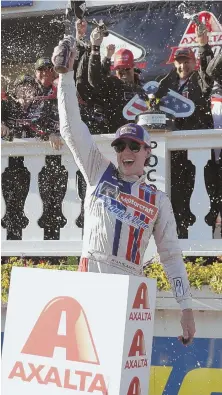  ?? AP PHOTO ?? FIRST TIME’S A CHARM: Ryan Blaney celebrates with his crew in Victory Lane after holding off Kevin Harvick to win the Pocono 400 yesterday in Long Pond, Pa., his first career victory on NASCAR’s top circuit.