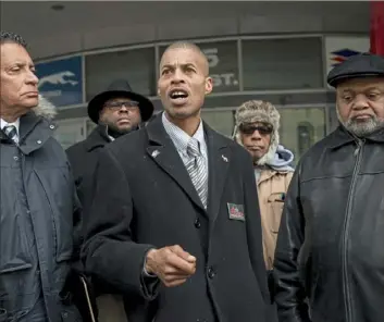  ?? Steph Chambers/Post-Gazette ?? William Anderson of Homewood (center) describes what he felt was racially discrimina­tory treatment by a Greyhound bus driver.