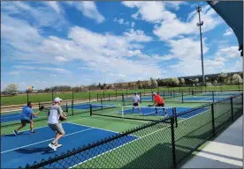  ?? David Jacobs/sdg Newspapers file ?? Ohio pickleball players are shown playing on new courts as the sport continues to grow. A tournament is coming to the region at Wooster.