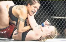  ?? AP ?? Amanda Nunes (top) of Brazil and Valentina Shevchenko of Kyrgzystan battle during their mixed martial arts bout at UFC 215 in Edmonton, Alberta, Canada, on Saturday.